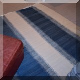 DR10. Blue and white striped woven rug. Approx. 8'10” x 11'10” 